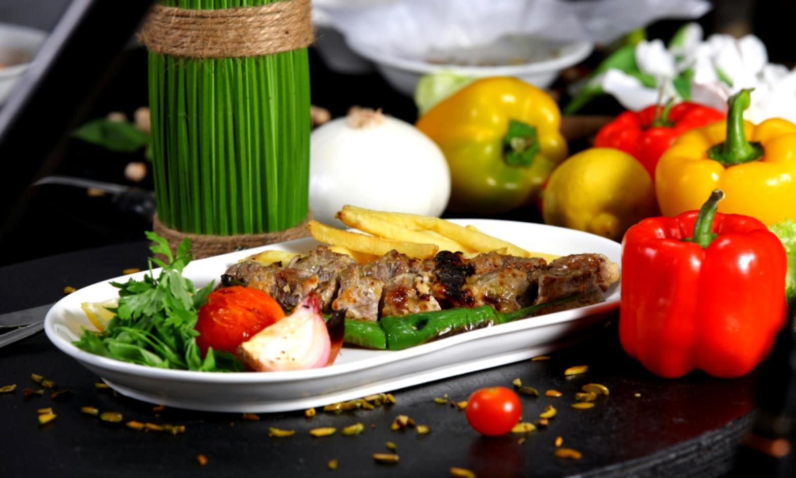 Professional training kitchen with commercial pizza ovens and preparation stations